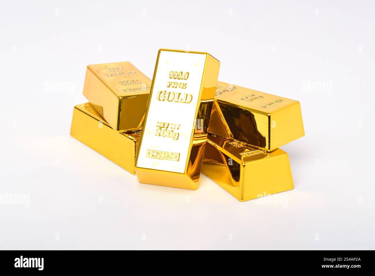 Many shiny gold bars isolated on white background Stock Photo - Alamy