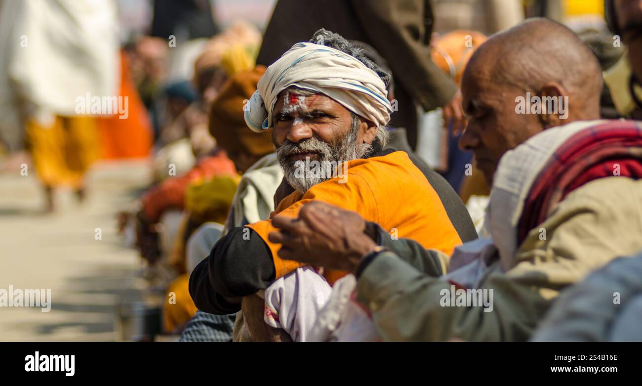 Elderly man in traditional attire at a vibrant cultural festival in ...