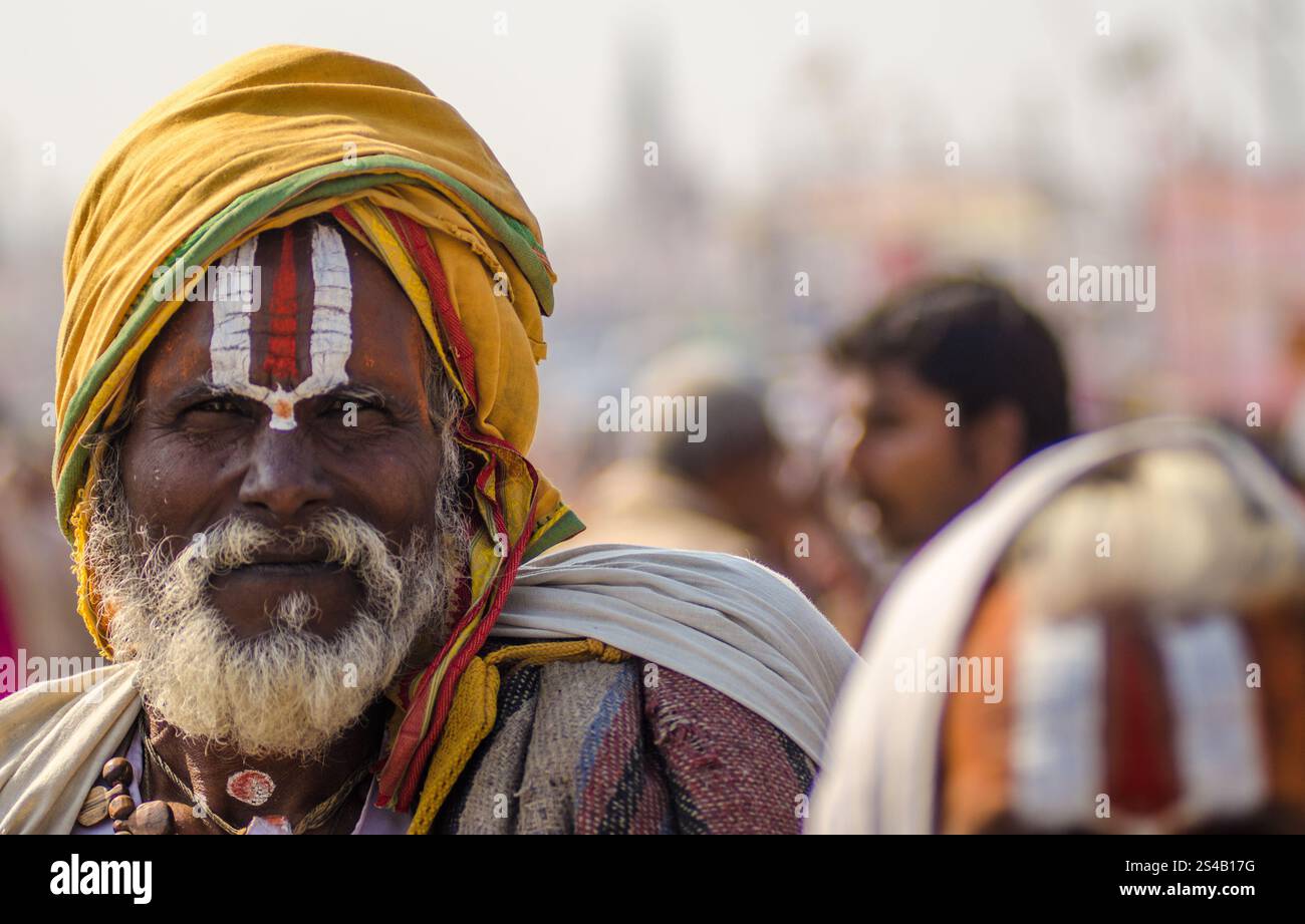 Elderly man in traditional attire at a vibrant cultural festival in ...