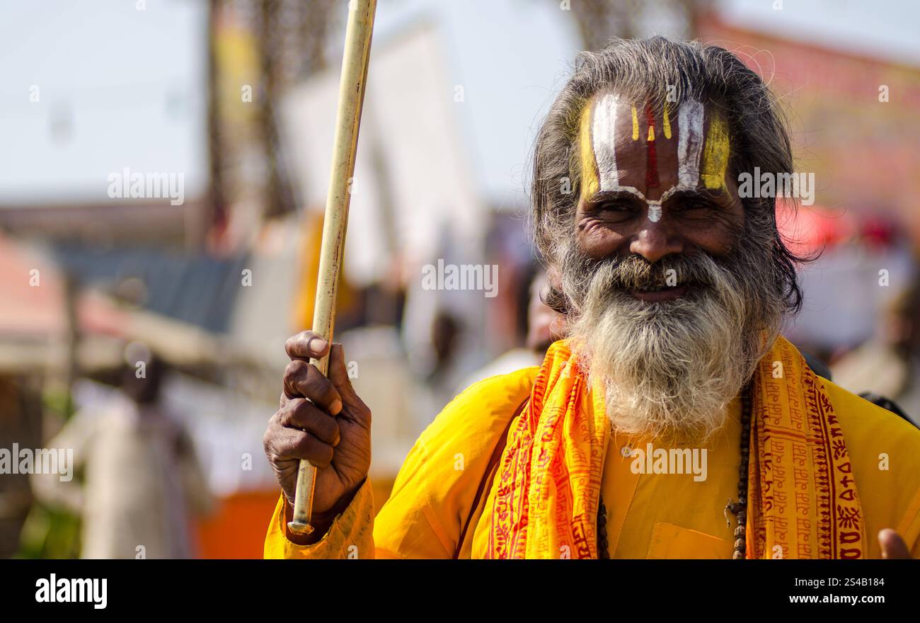 Elderly man in traditional attire at a vibrant cultural festival in ...