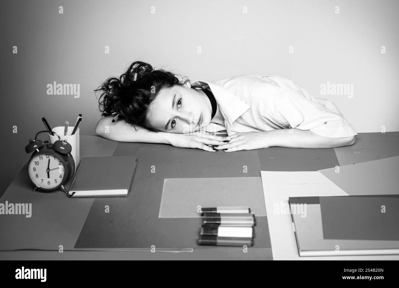Sad or bored little student girl in classroom Stock Photo - Alamy