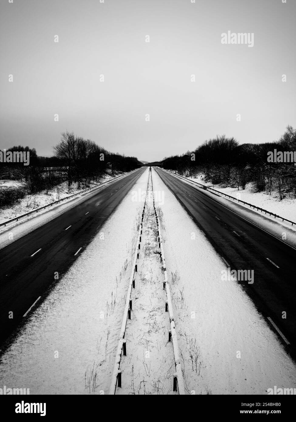 A snow covered M61 at Adlington near Chorley with no traffic  in the two clear lanes - Smartphone Captured Stock Image