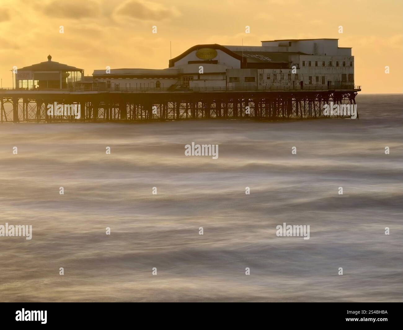 Blurred sea at high tide late in the afternoon with Blackpool North pier in distance - Smartphone Captured Stock Image Blurred sea at high tide late in the afternoon with Blackpool North pier in distance - Smartphone Captured Stock Image
