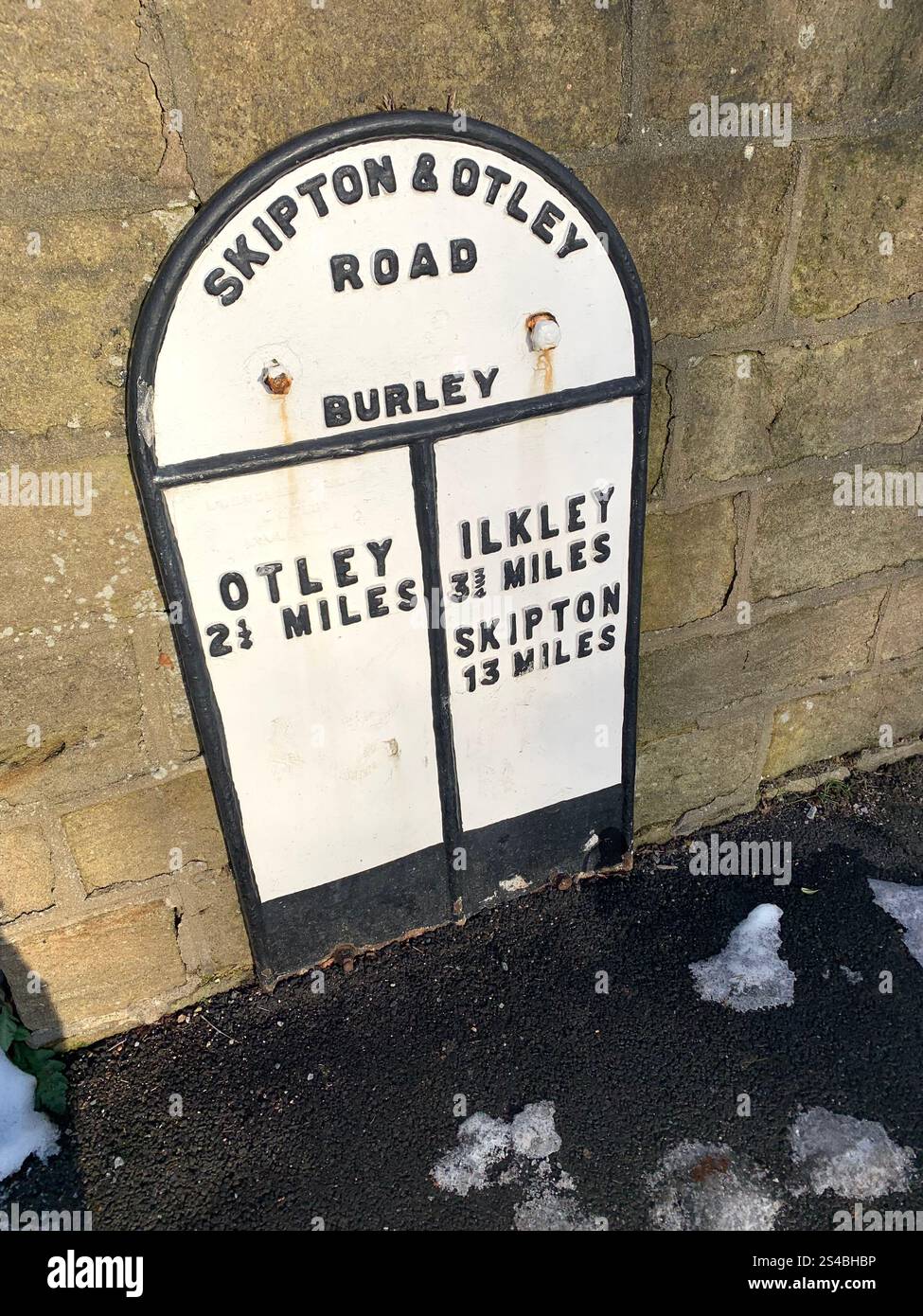 Burley in Wharfedale UK Yorkshire England Village Town people Winter Autumn Spring cold weather ice snow stone houses old Victorian sign gardens - Smartphone Captured Stock Image