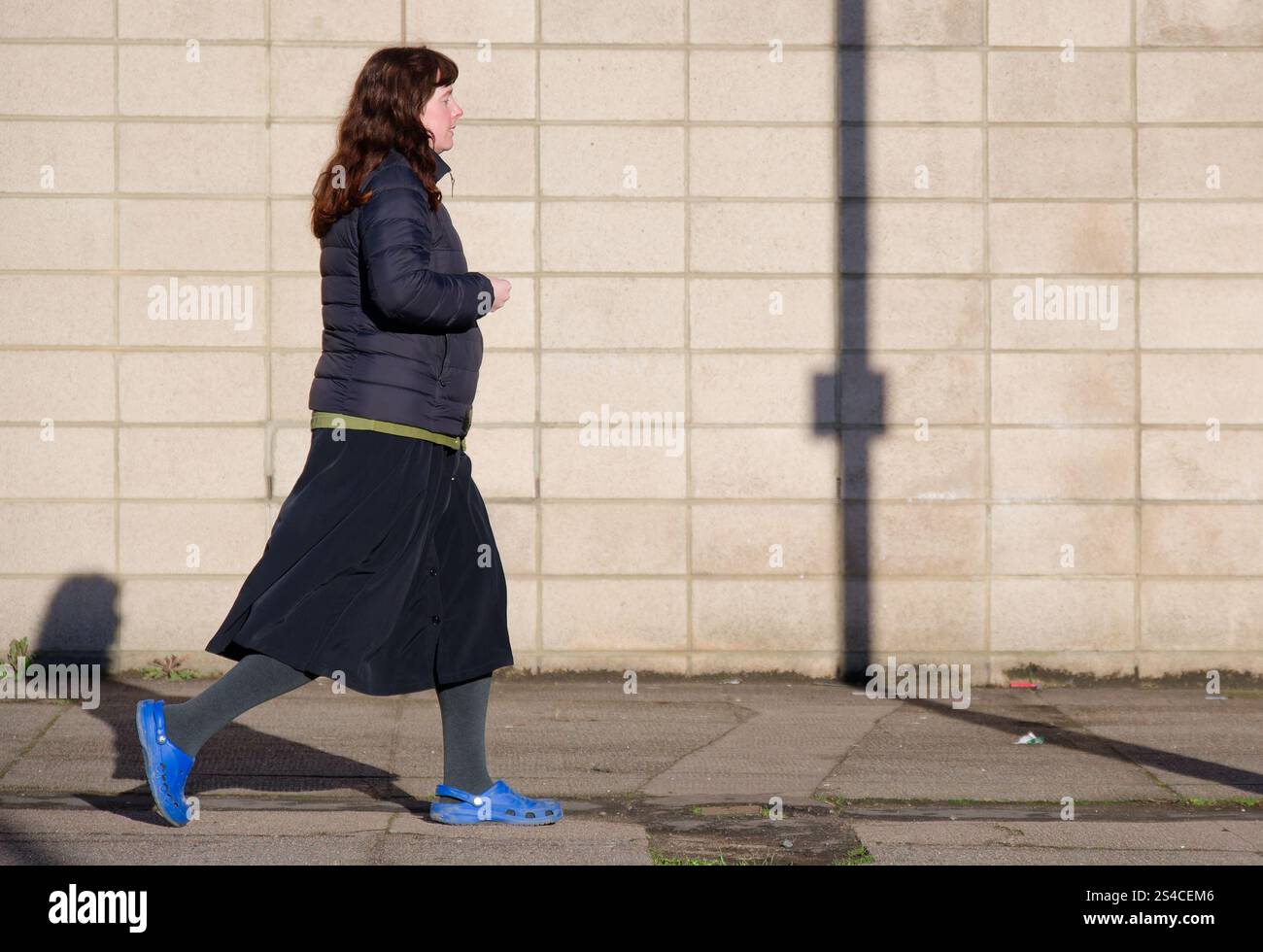 Woman walking in the city for health and wellbeing Stock Photo - Alamy