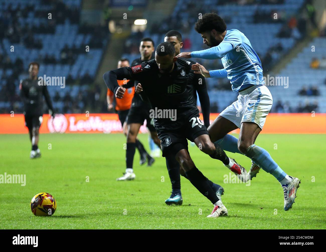 Sheffield Wednesday's Michael Ihiekwe and Coventry City's Ellis Simms ...