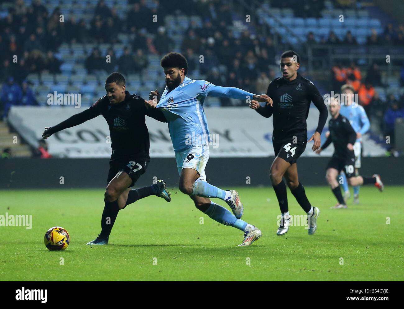 Sheffield Wednesday's Yan Valery and Coventry City's Ellis Simms battle ...