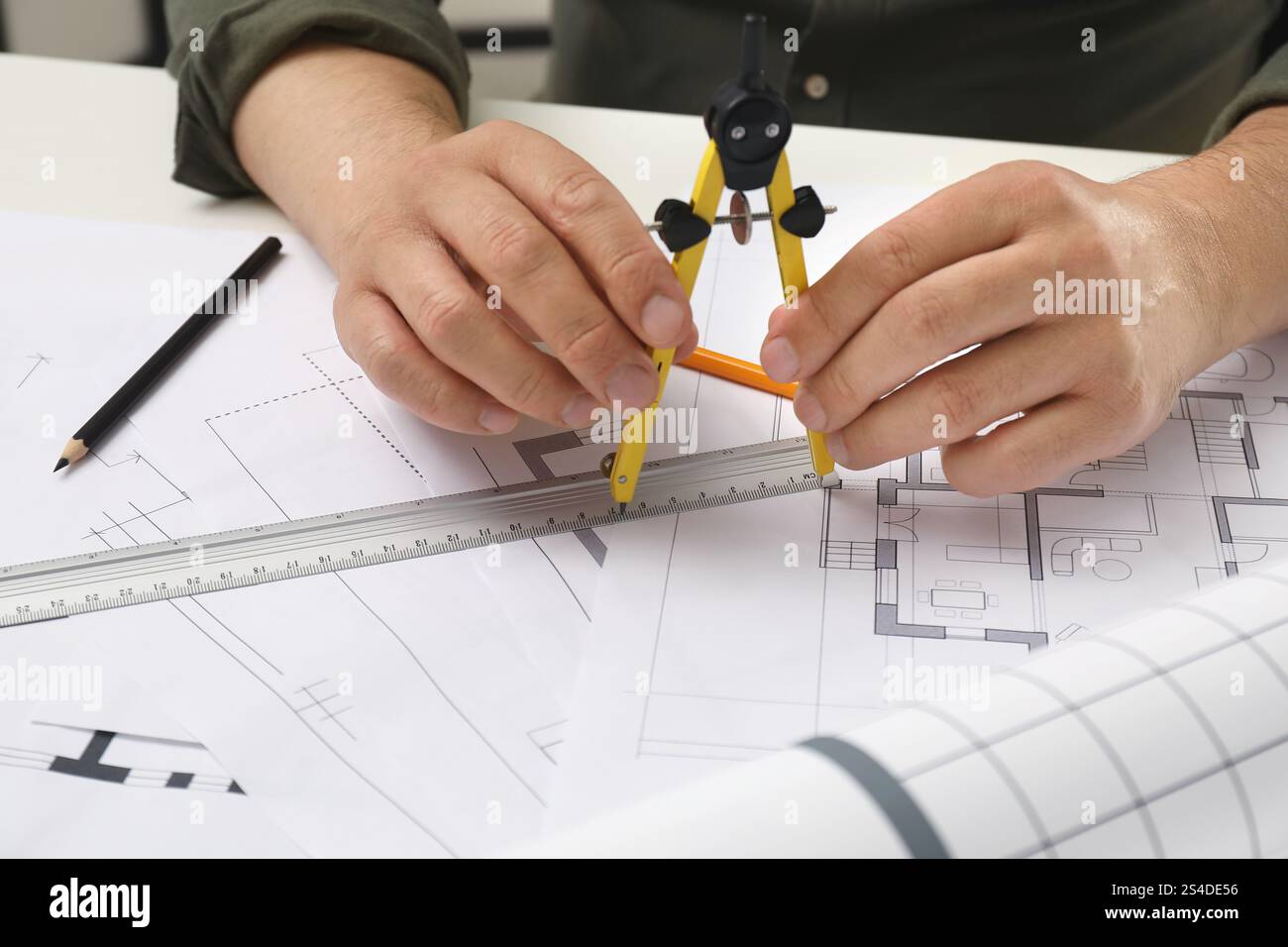 Project Alignment Technical Drawing Architect working with project, closeup. Different technical drawings ...