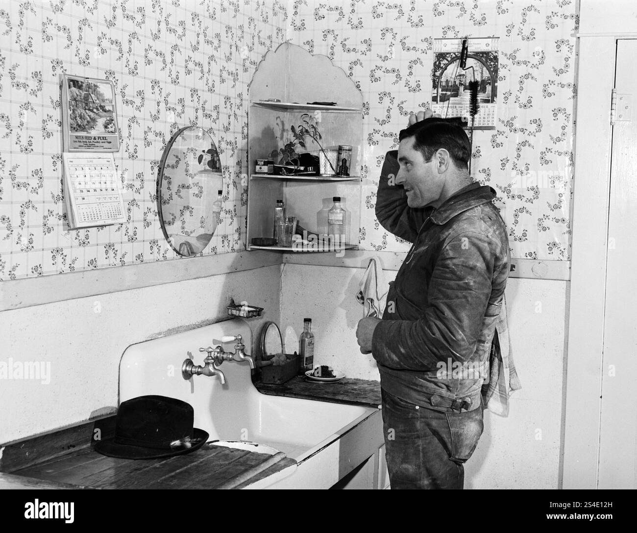 Lee Wagoner, farmer on Black Canyon Project, washes up for dinner. Canyon County, Idaho by Russell Lee Stock Photo