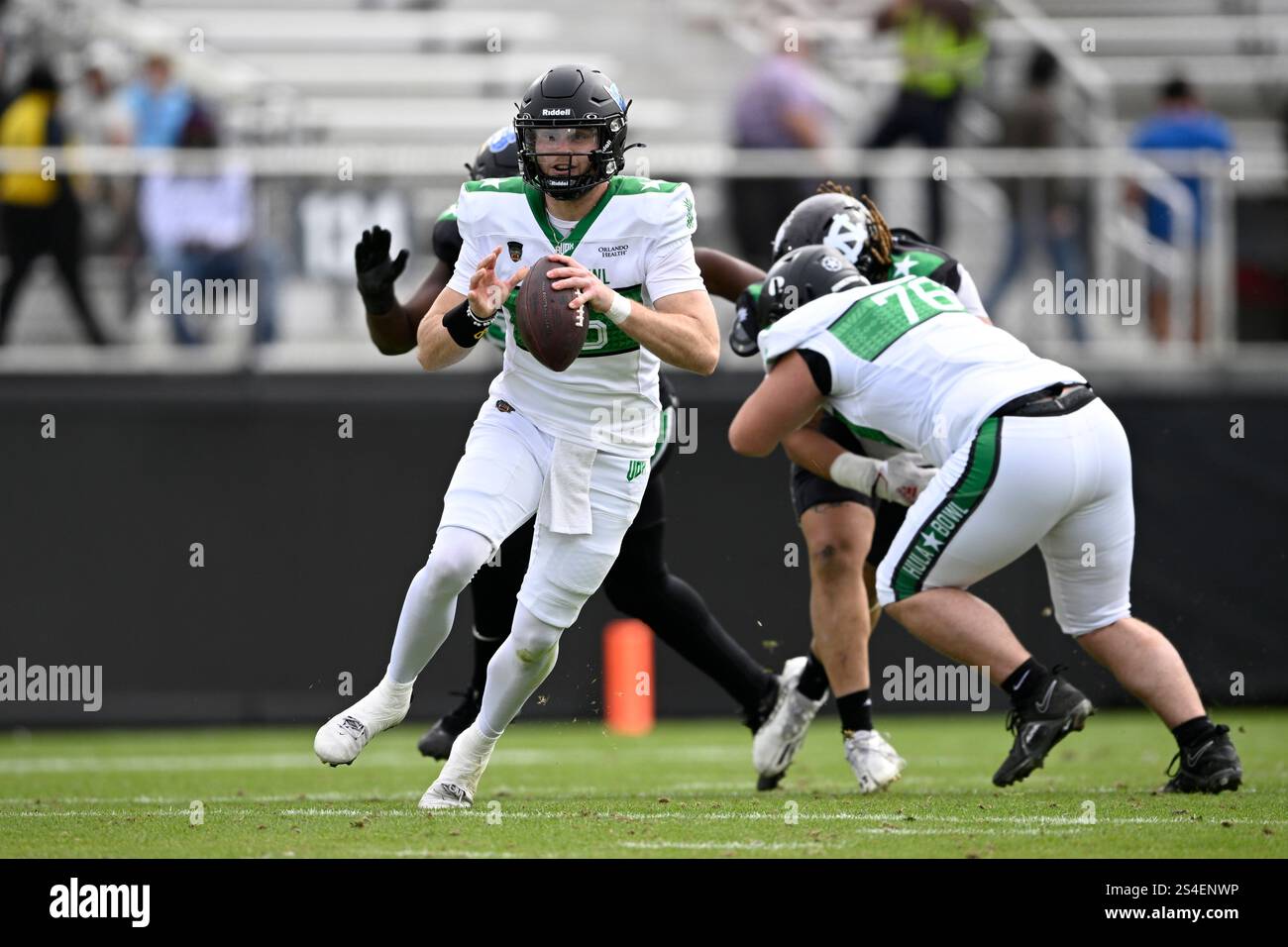 Team Kai quarterback Hunter Dekkers (16), of Iowa Western, looks for a