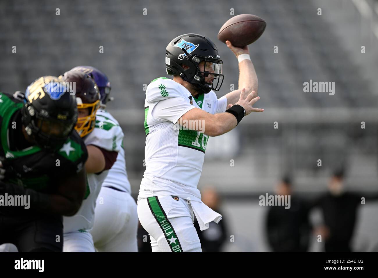 Team Kai quarterback Hunter Dekkers (16), of Iowa Western, throws a