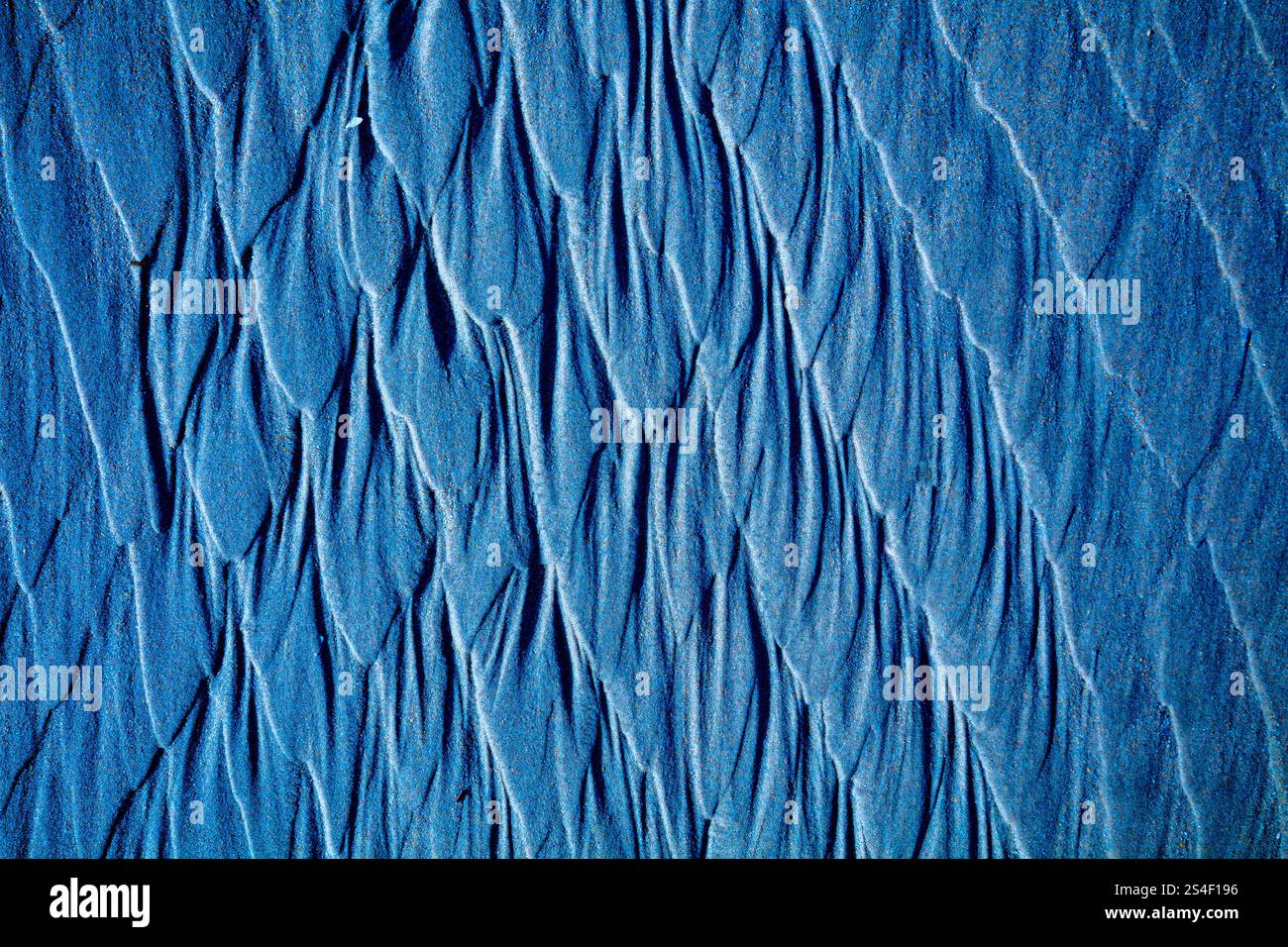 Abstract sandy beach background. The texture of sand after a low tide ...
