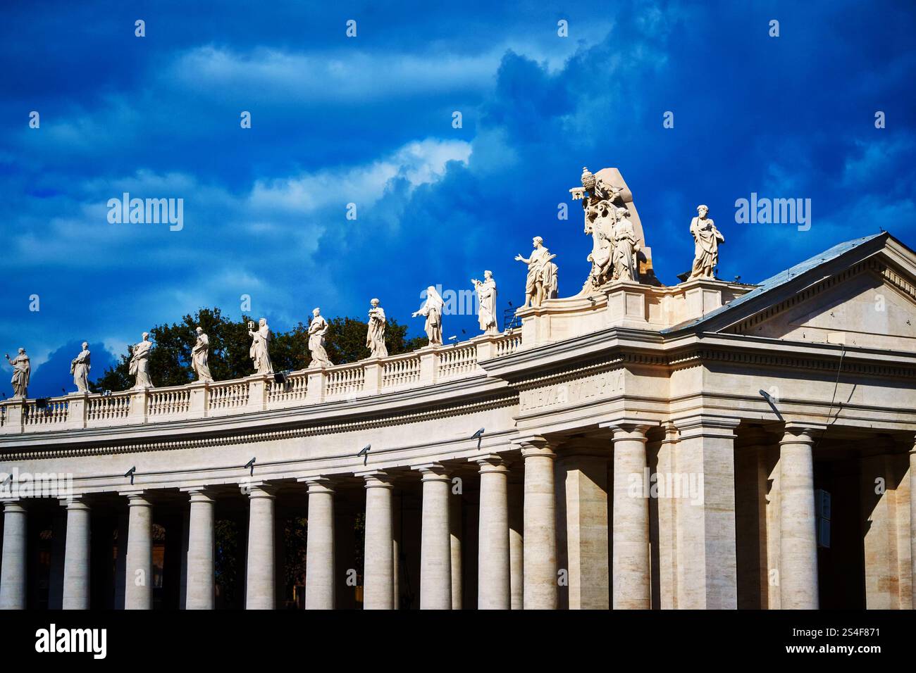 Colonnades that surround St. Peter's Square in Rome, Vatican City, with ...