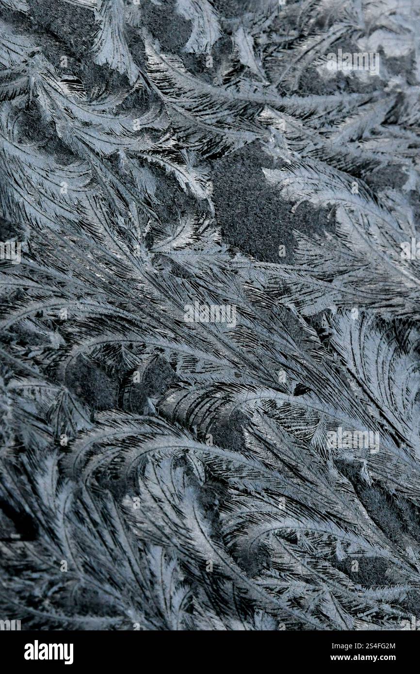 Frost patterns on car window Stock Photo - Alamy