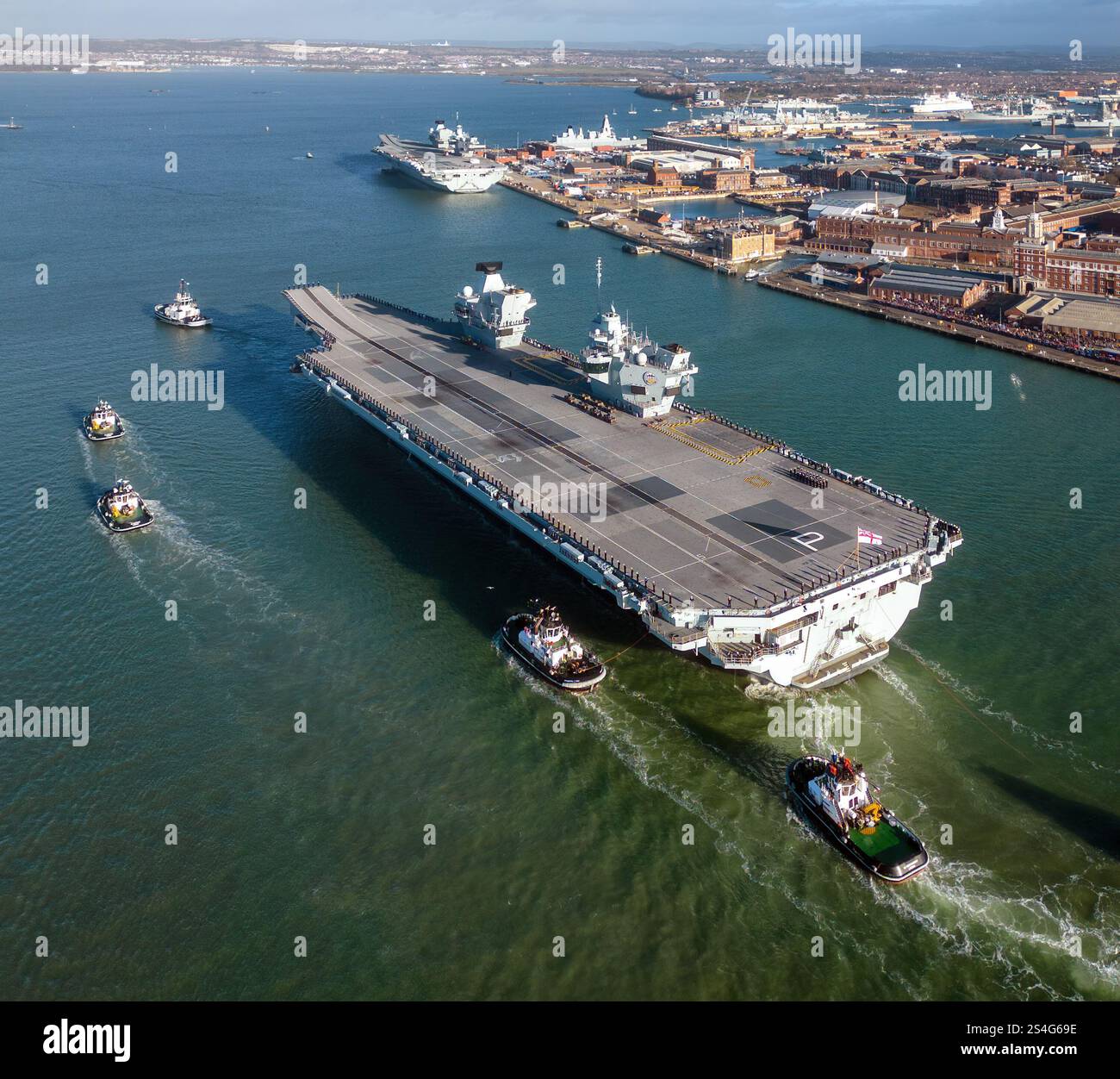 Aerial view of the Royal Navy aircraft carrier HMS Prince of Wales (R09) returning to Portsmouth naval base. Stock Photo