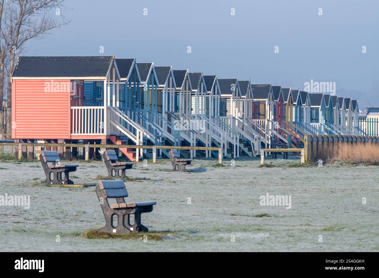 Beach huts at Leysdown-on-Sea on the Isle of Sheppey, Kent, England, UK, on a cold frosty winter morning Stock Photo