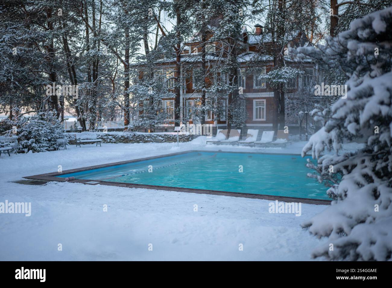 Spa Cold Pool Open-air swimming pool with warm water, loungers in cold weather ...