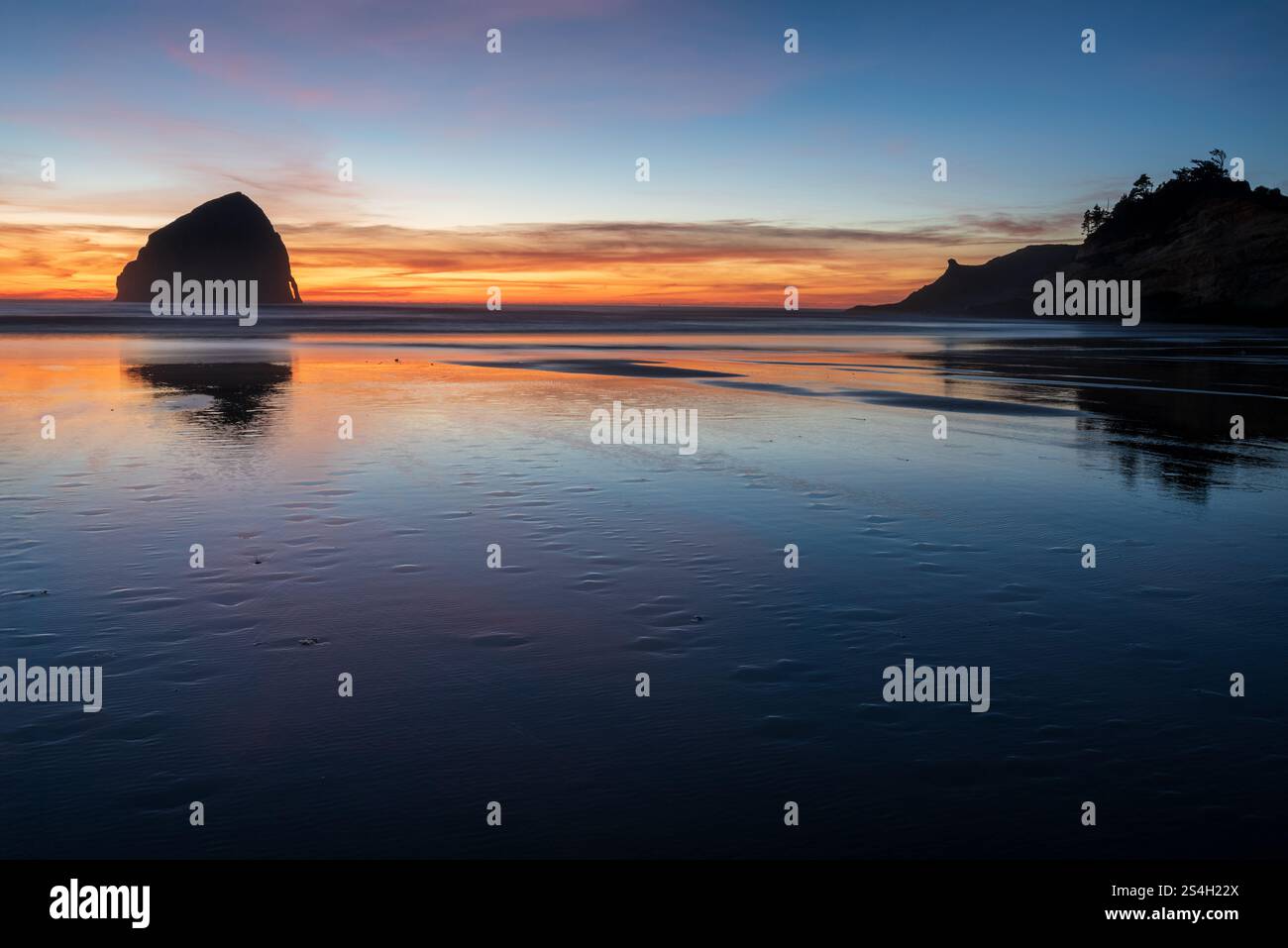 Kiwanda Beach, Cape Kiwanda and Haystack Rock at sunset, Oregon. Stock Photo