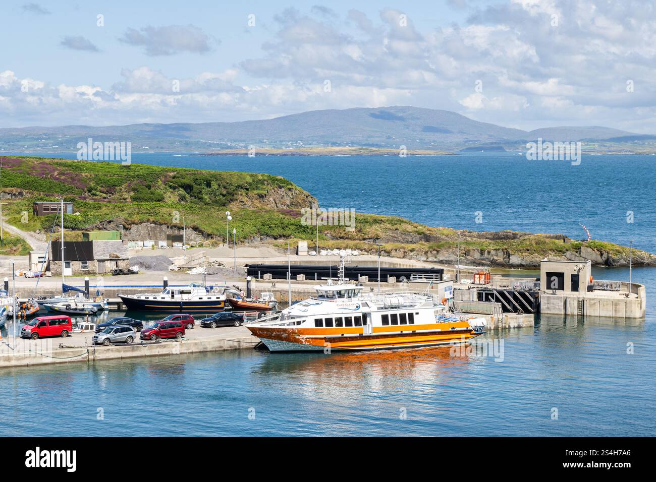 Cape Clear ferry 'Carraig Aonair' moored in the harbour of Cape Clear Island, West Cork, Ireland. Stock Photo
