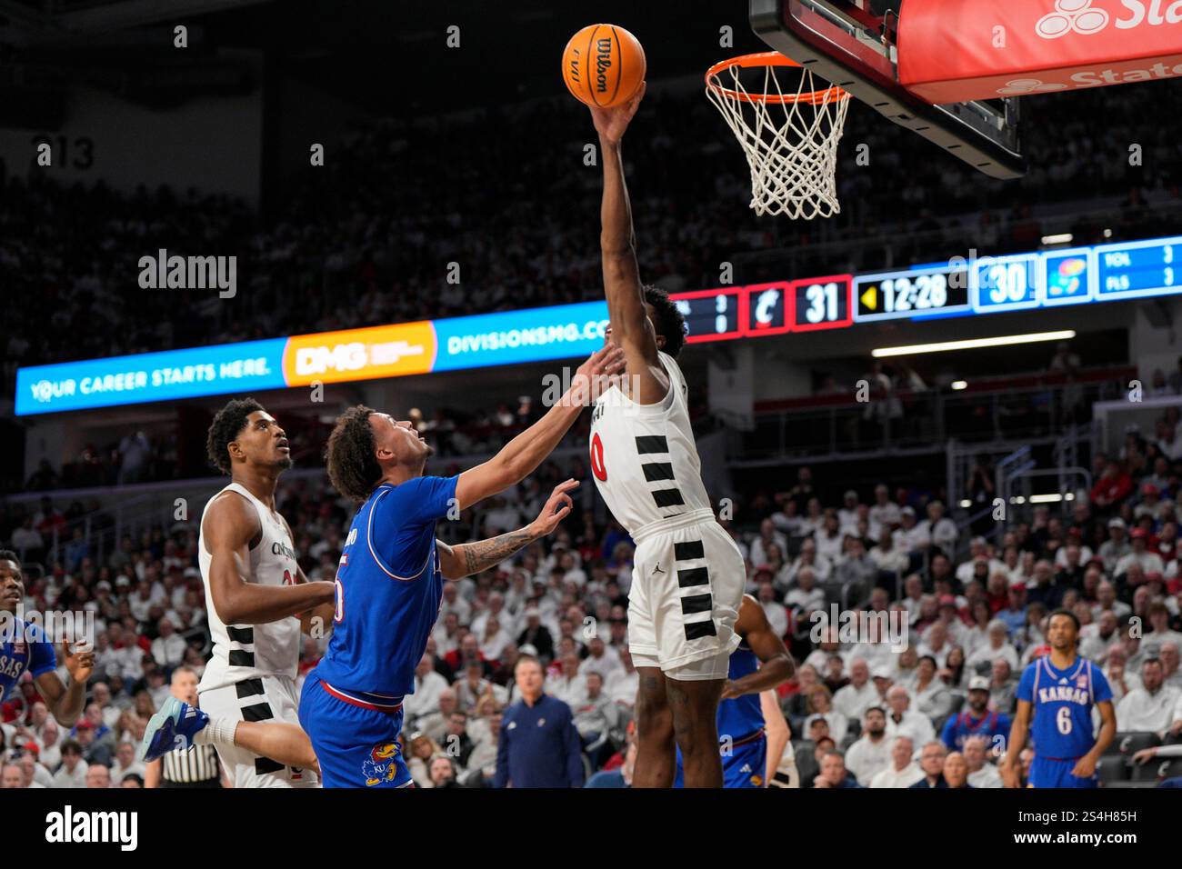 Cincinnati guard Josh Reed (10) blocks a shot by Kansas guard Zeke Mayo ...