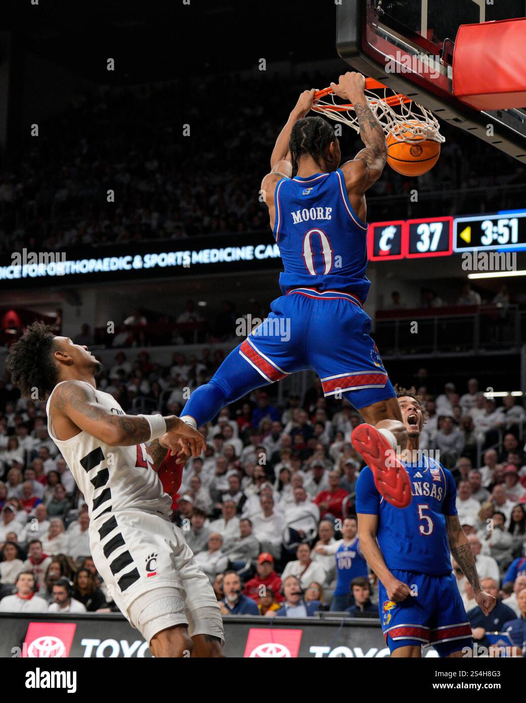 Kansas Dunks Kansas guard Shakeel Moore (0) dunks during an NCAA college basketball ...