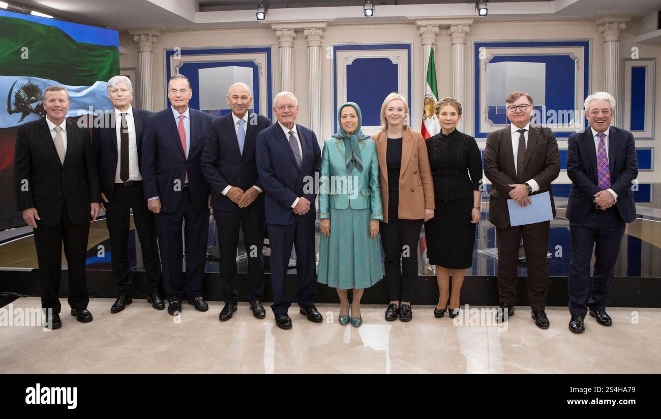 The speakers at the conference from left, General Tod Wolters, Ola Elvestuen, Gen. James Jones, Janez Jansa, Lt. Gen. Keith Kellogg, Maryam Rajavi, Liz Truss, Yulia Tymoshenko, Hryhoriy Nemyria and John Bercow pose for a photo. In a gathering at the Trans-Atlantic conference held in Auvers-sur-Oise (north of Paris) titled New Policy toward the Iranian Regime. Standing with the Organized Resistance, former world leaders and military officials from Europe and the U.S. convened to discuss and propose a new strategic approach towards Iran. Stock Photo