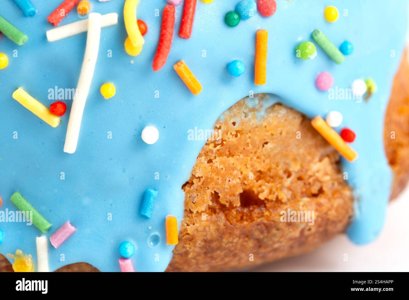 Cake with blue icing and colorful sprinkles on white background Stock ...