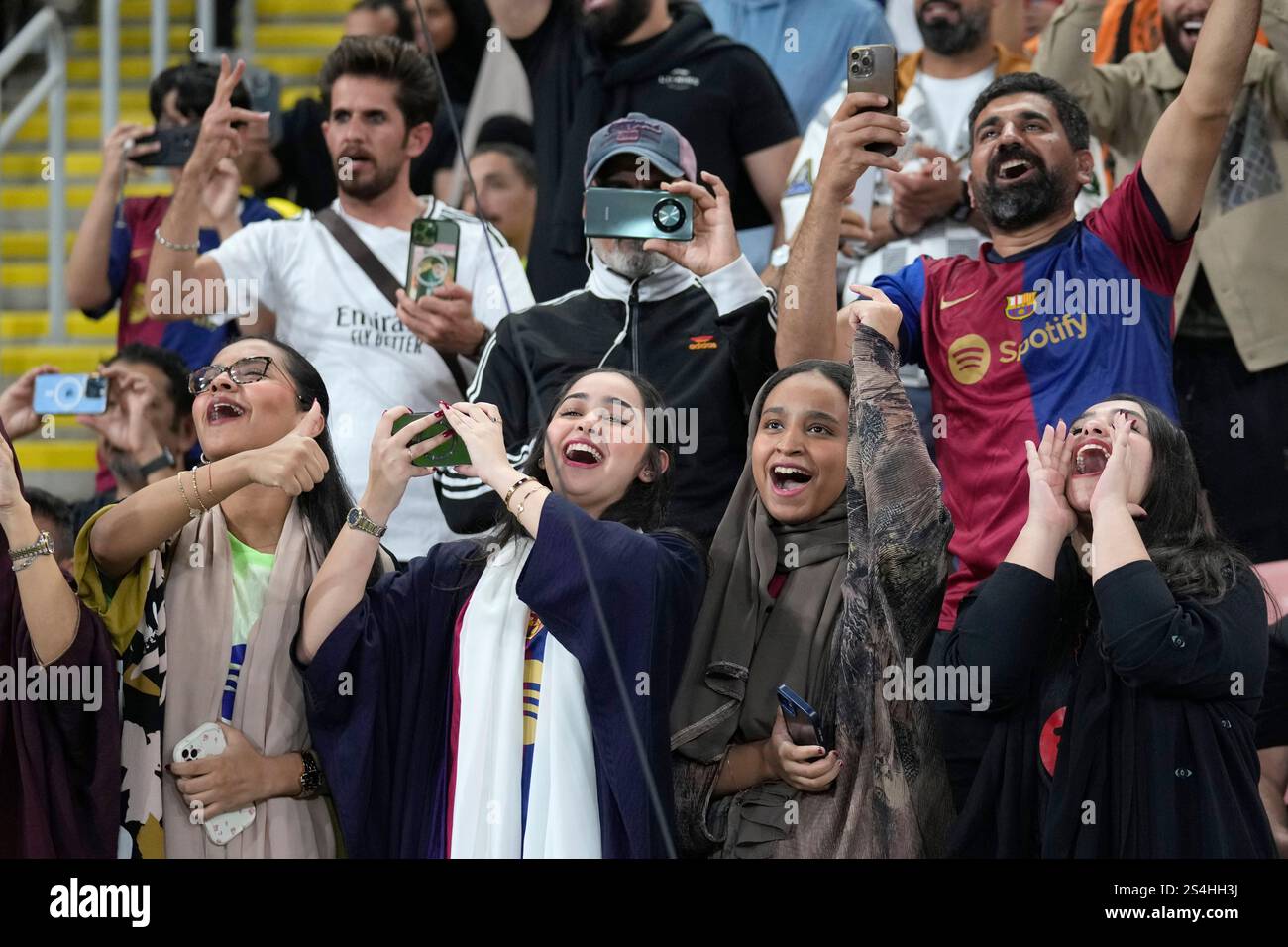 Fans cheer ahead the Spain Super Cup final soccer match between Real