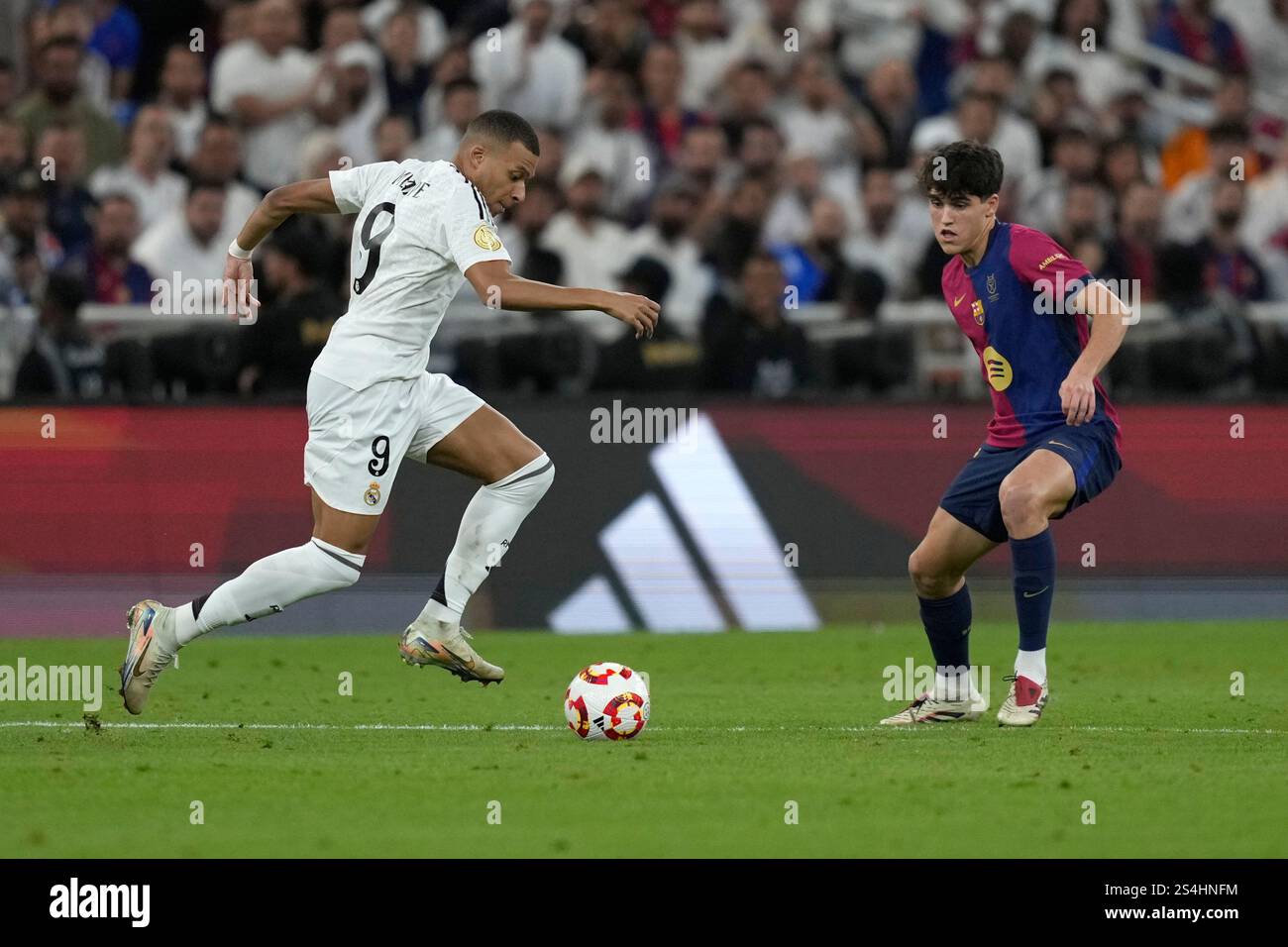 Real Madrid's Kylian Mbappe, left, in action during the Spain Super Cup
