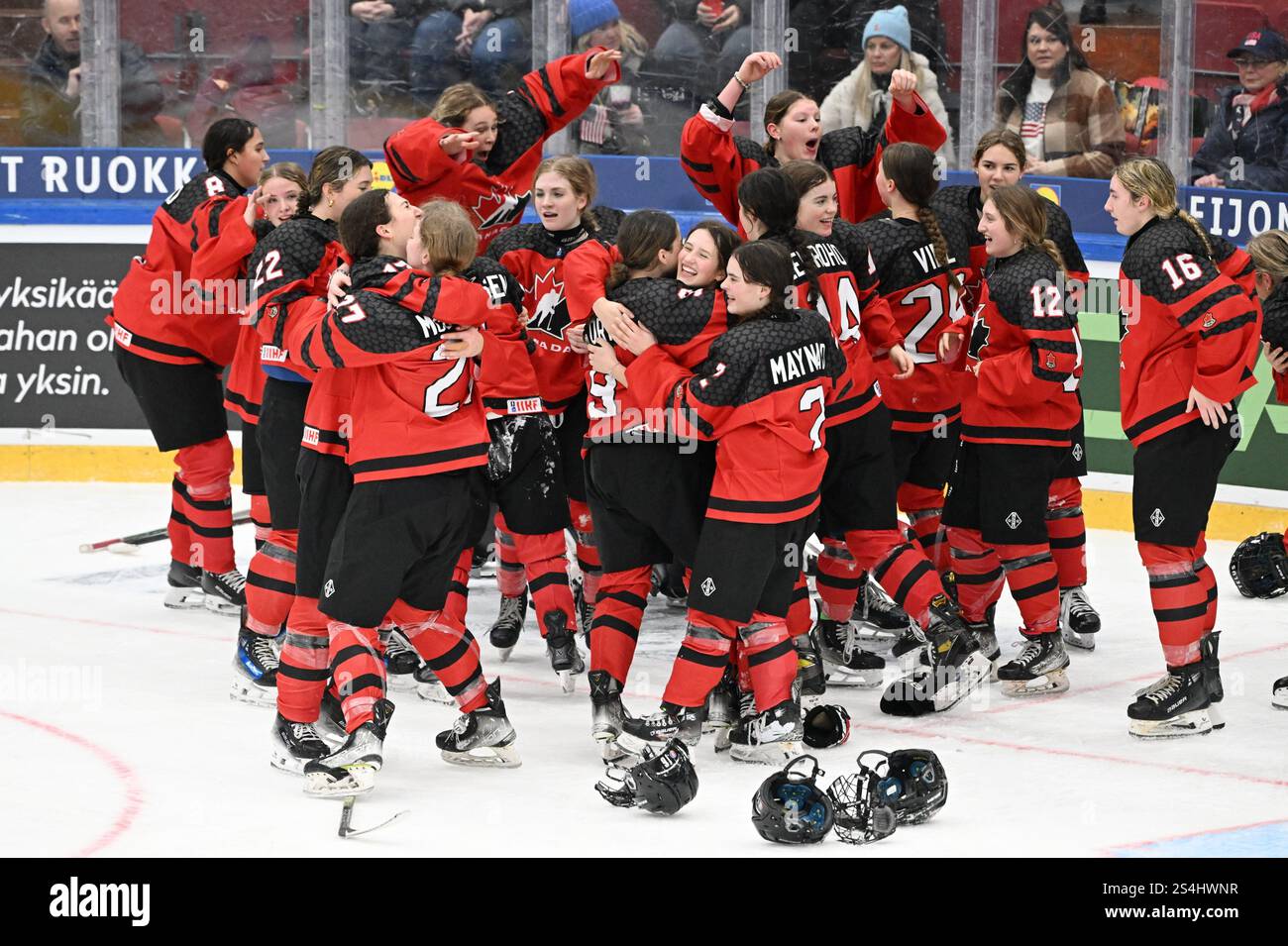 Players of Team Canada celebrate after winning the 2025 IIHF U18 Women