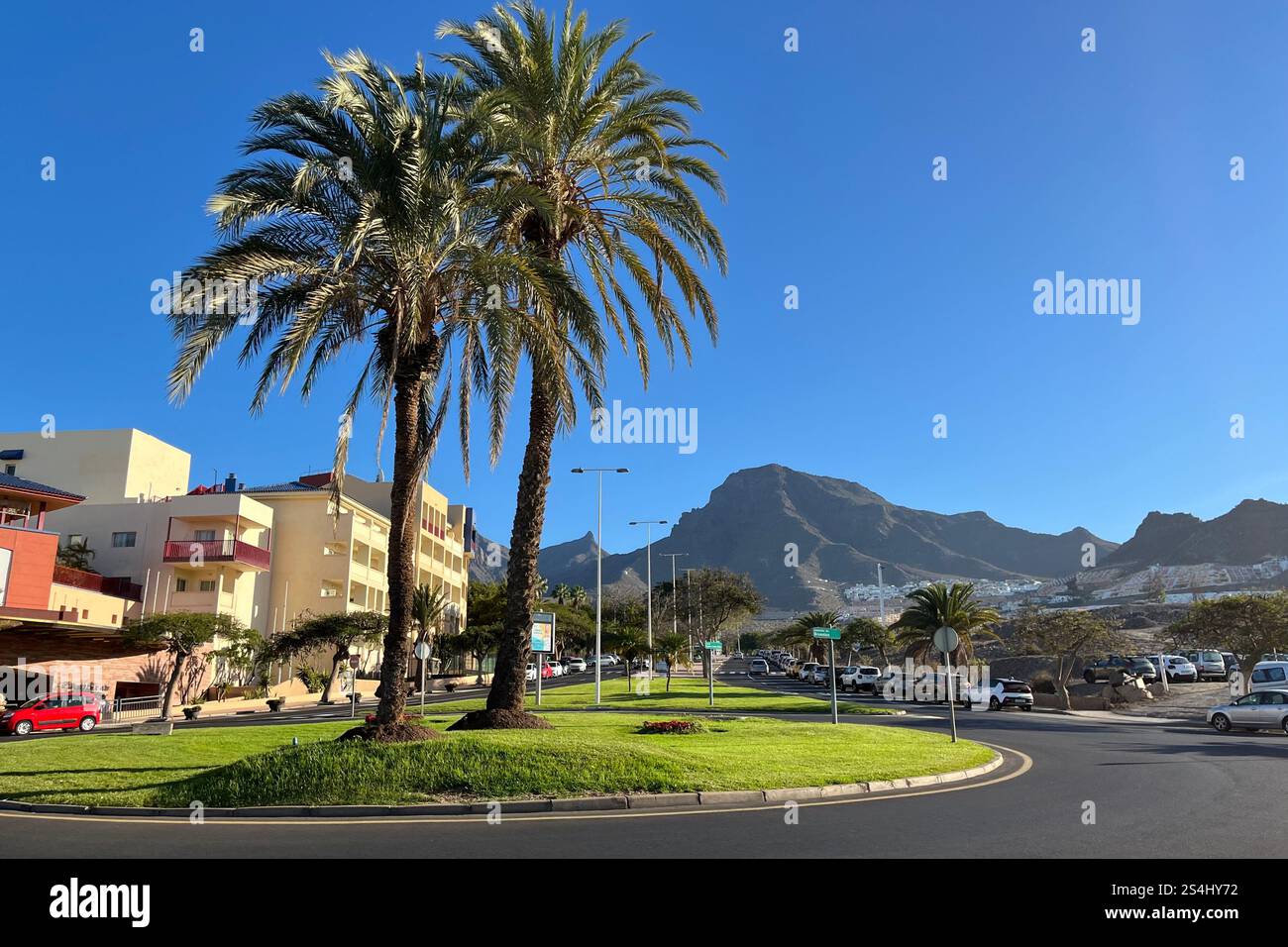 Looking towards the mountains from the Palm Tree roundabout at Avenida de Bruselas in Costa Adeje. Tenerife, Canary Islands, Spain. 11th January 2025. - Smartphone Captured Stock Image