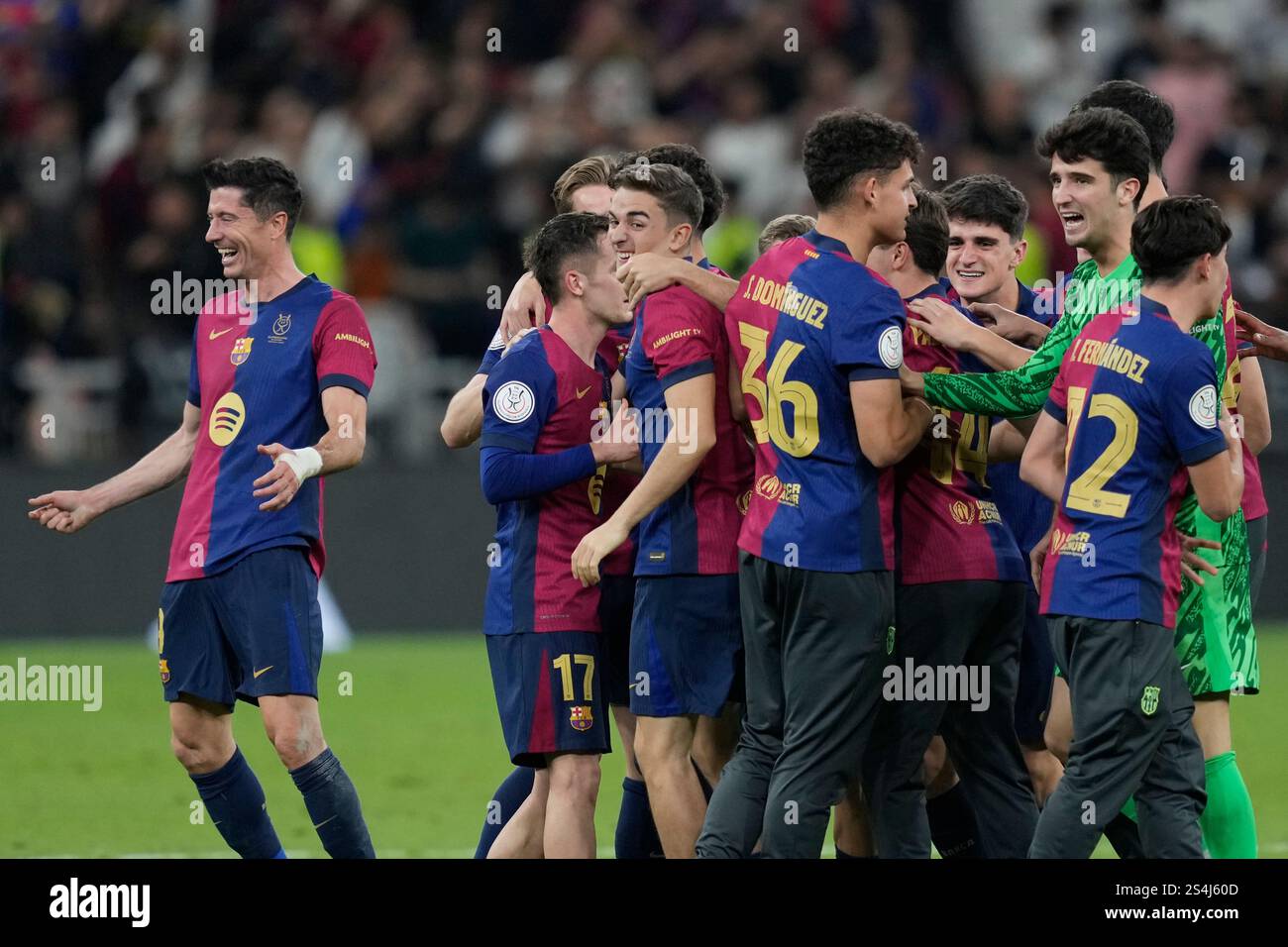 Barcelona players celebrate at the end of the Spain Super Cup final