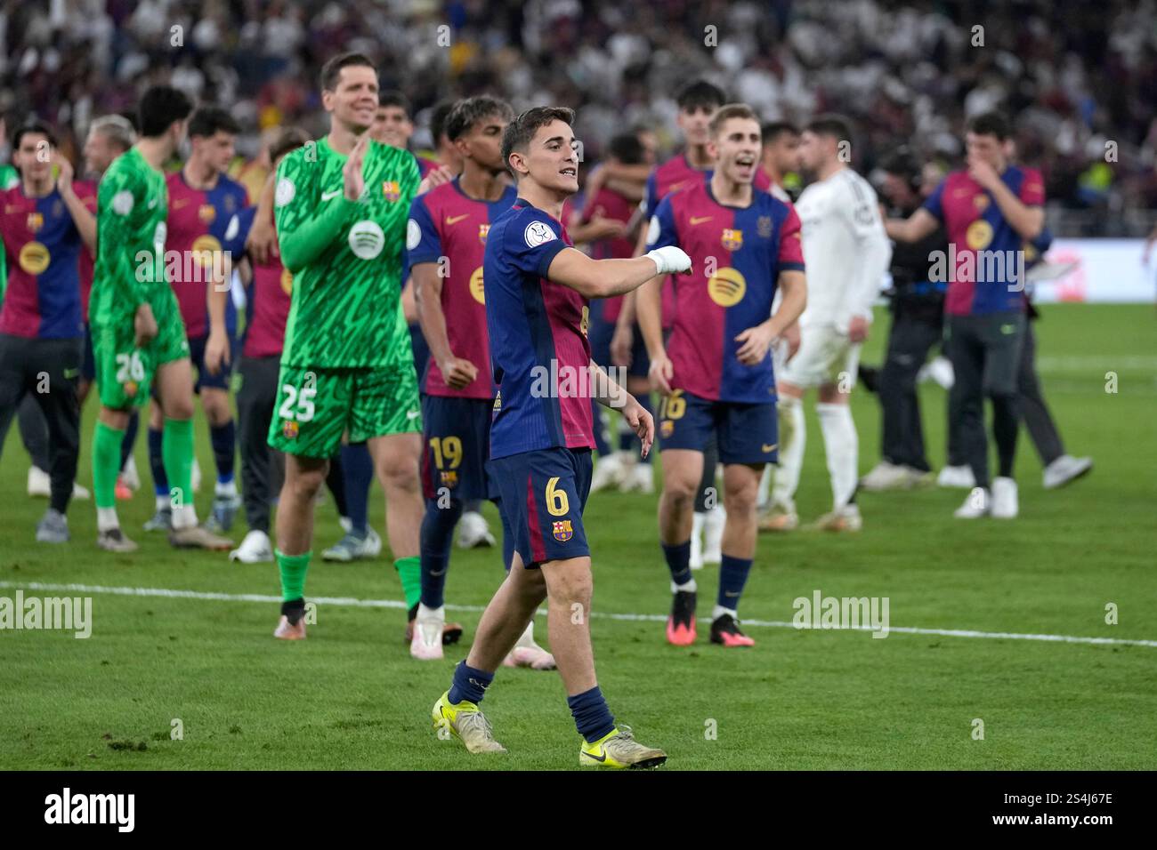 Barcelona players celebrate at the end of the Spain Super Cup final