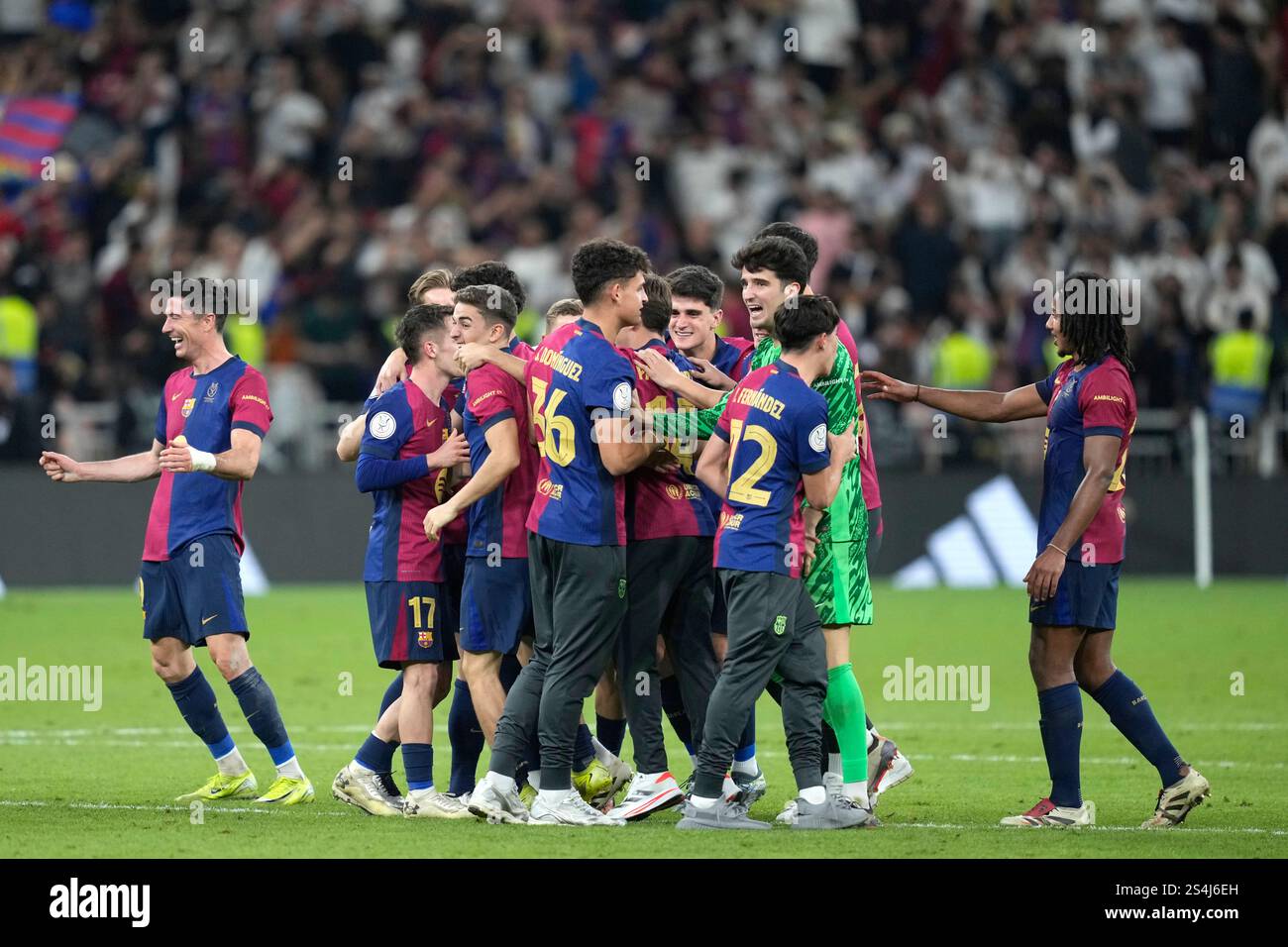 Barcelona players celebrate at the end of the Spain Super Cup final