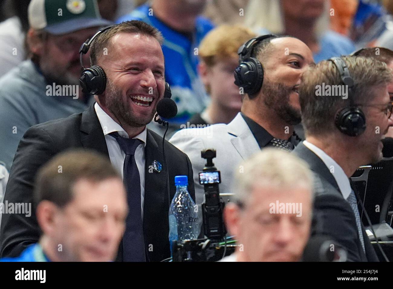 Former Dallas Mavericks player J.J. Barea is seen doing a broadcast