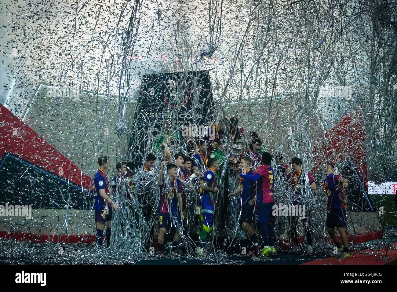 Barcelona players celebrate with their team's trophy of the Spanish