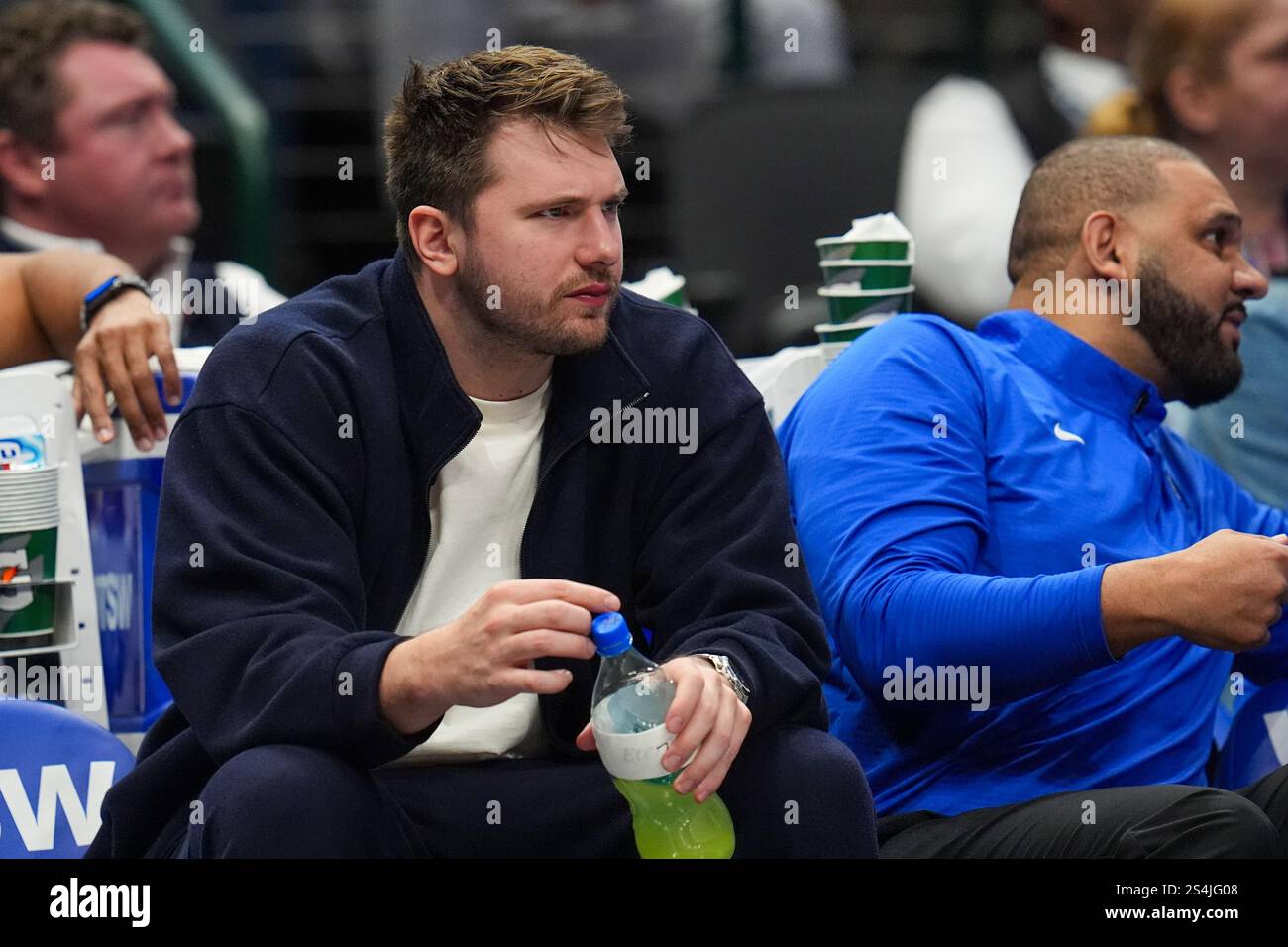 Dallas Mavericks guard Luka Doncic looks on from the bench during the