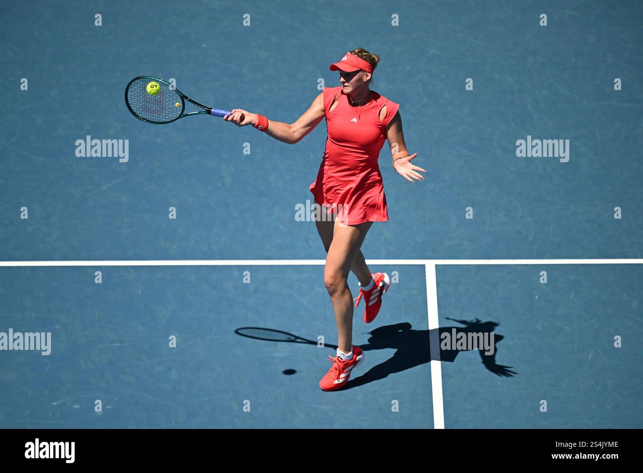 Ashlyn Krueger of USA returns during her round 1 match against Ajla