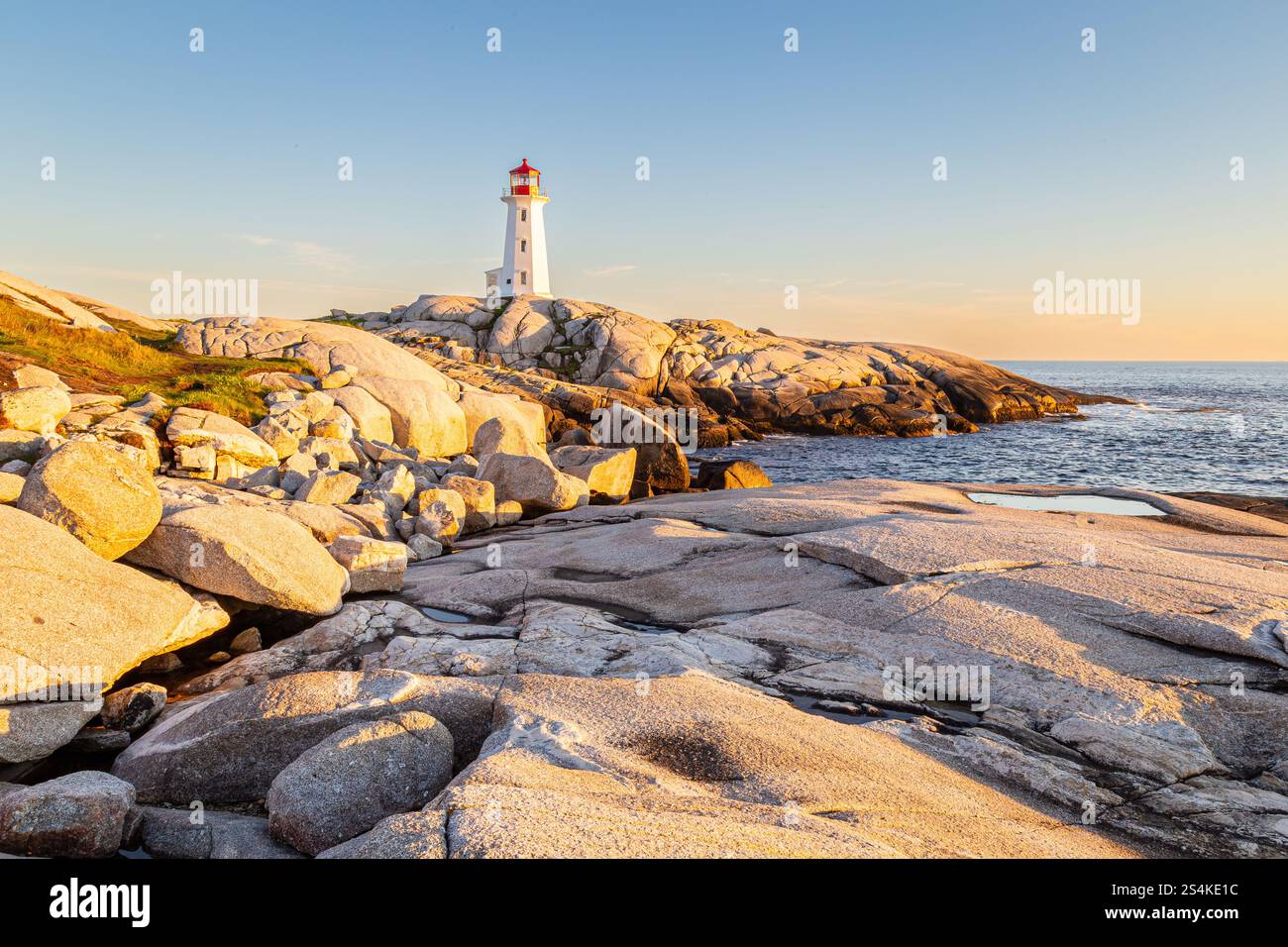 sunset-by-the-coast-at-peggy-s-cove-lighthouse-in-nova-scotia-this