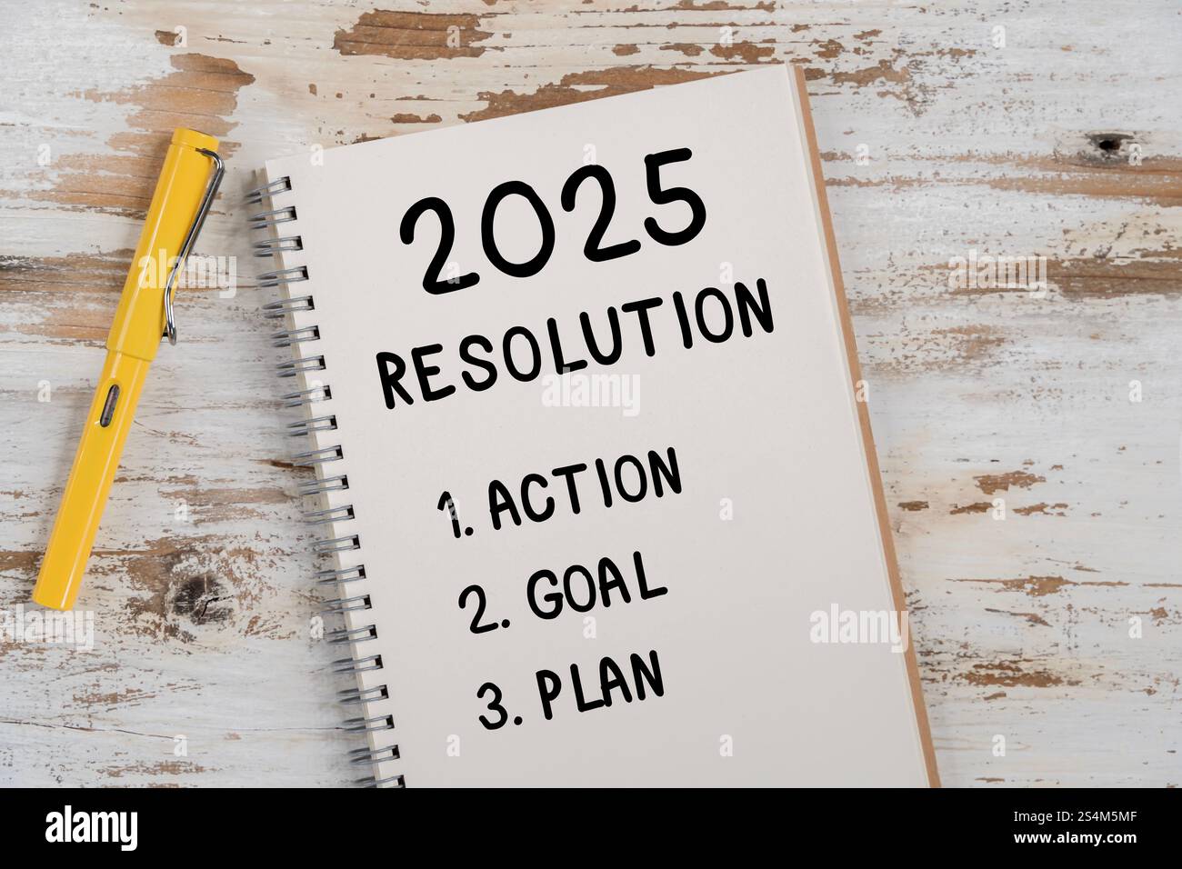 2025 Happy New Year Resolution Goal List and Plans Setting. Business office desk with notebook written about plan listing of new year goals and resolu Stock Photo