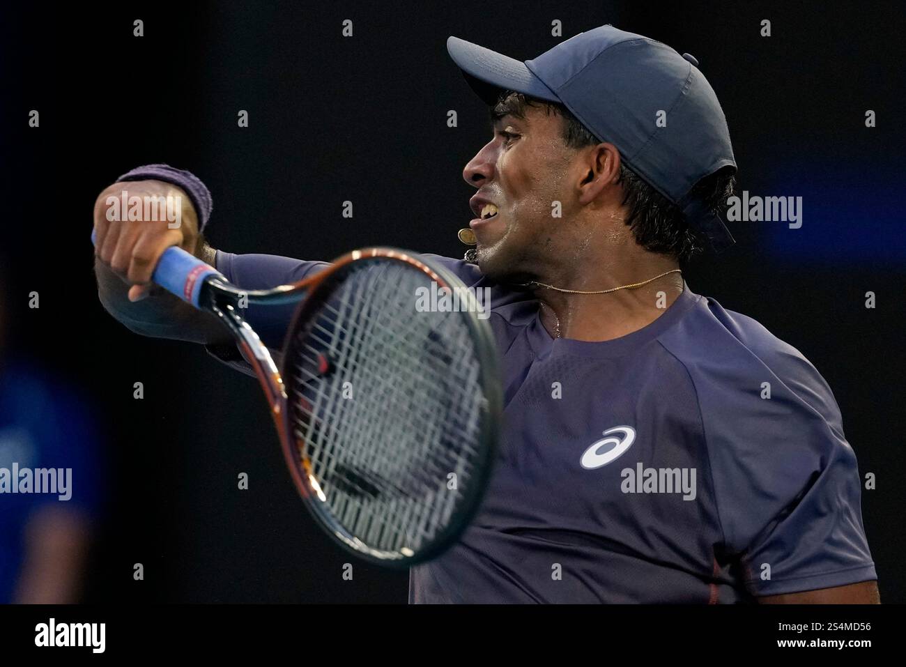 Nishesh Basavareddy of the U.S. plays a forehand return to Novak