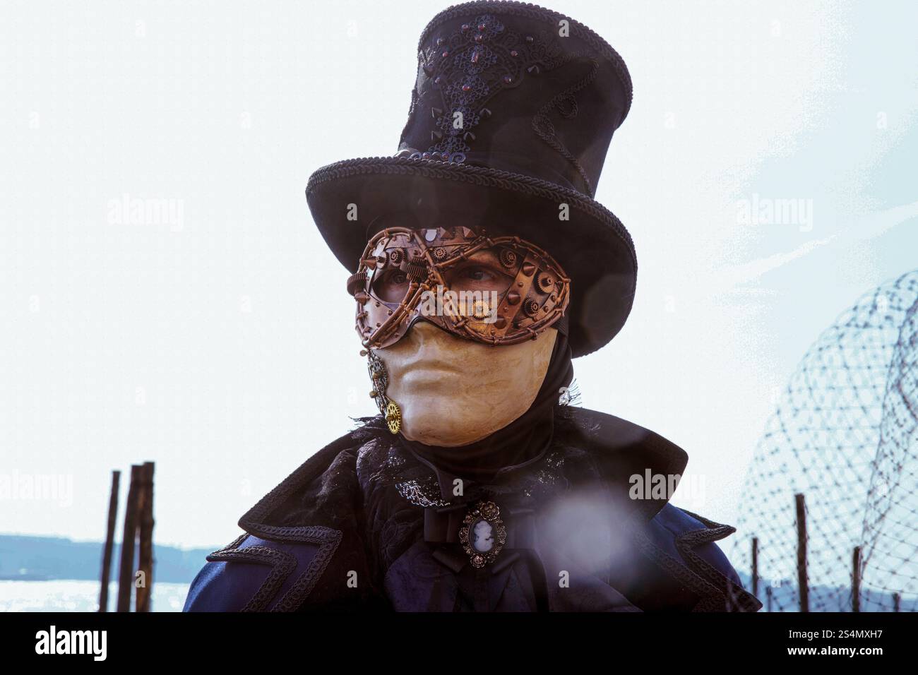 Steampunk masked figure with top hat by water Stock Photo - Alamy