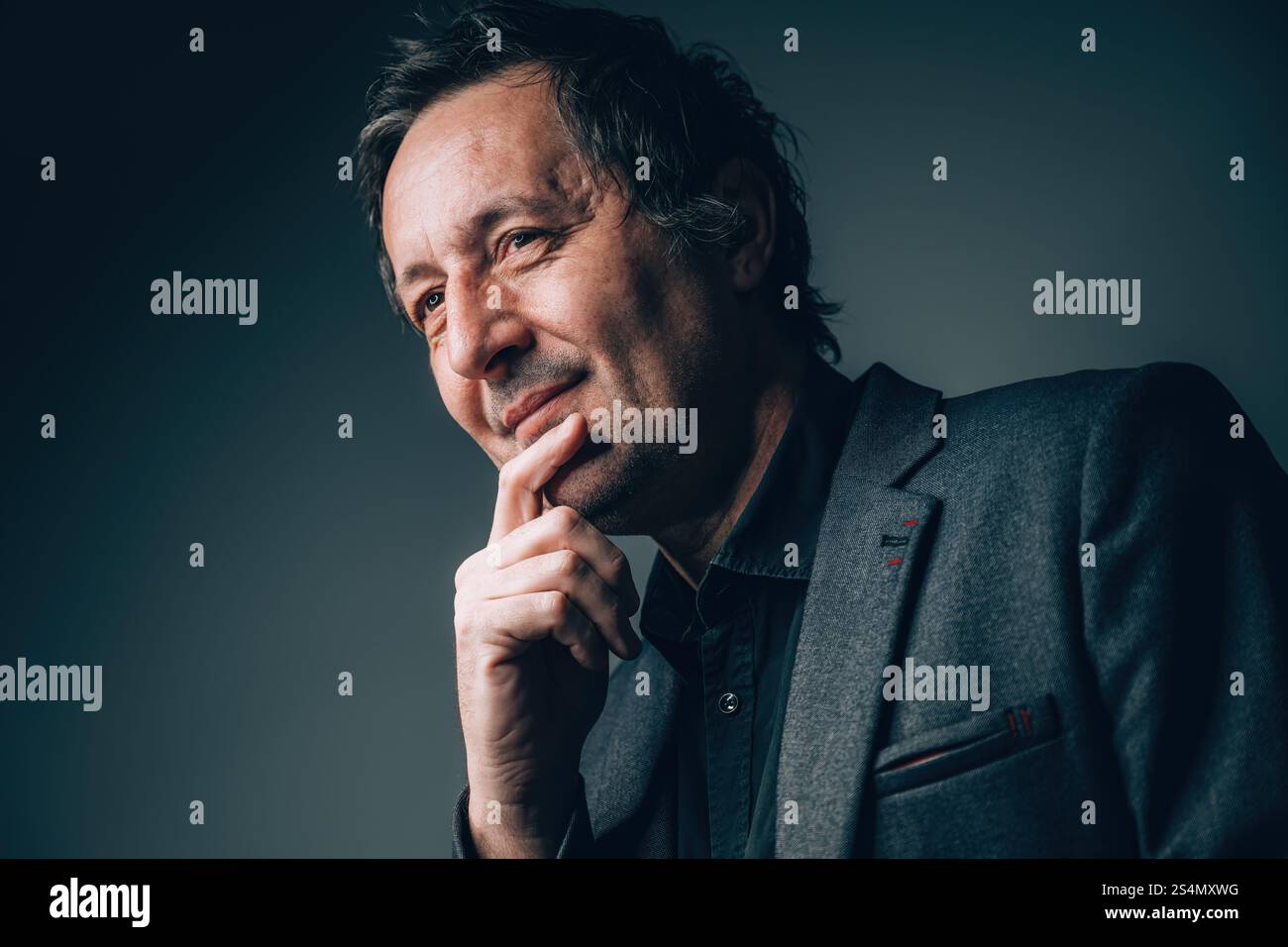 Smiling Depression concept, portrait of mature caucasian businessman with mental health condition, selective focus Stock Photo