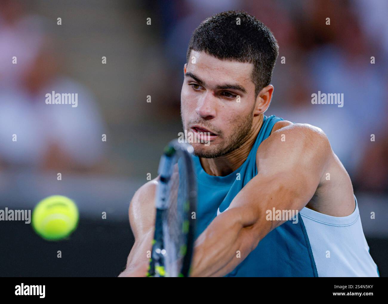 Melbourne, Australia. 13th Jan, 2025. Carlos Alcaraz hits a return during the men's singles first round match between Carlos Alcaraz of Spain and Alexander Shevchenko of Kazakhstan at Australian Open tennis tournament in Melbourne, Australia, Jan. 13, 2025. Credit: Chu Chen/Xinhua/Alamy Live News Stock Photo