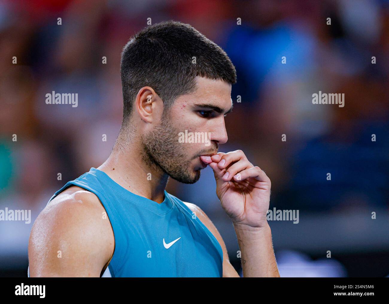 Melbourne, Australia. 13th Jan, 2025. Carlos Alcaraz reacts during the men's singles first round match between Carlos Alcaraz of Spain and Alexander Shevchenko of Kazakhstan at Australian Open tennis tournament in Melbourne, Australia, Jan. 13, 2025. Credit: Chu Chen/Xinhua/Alamy Live News Stock Photo