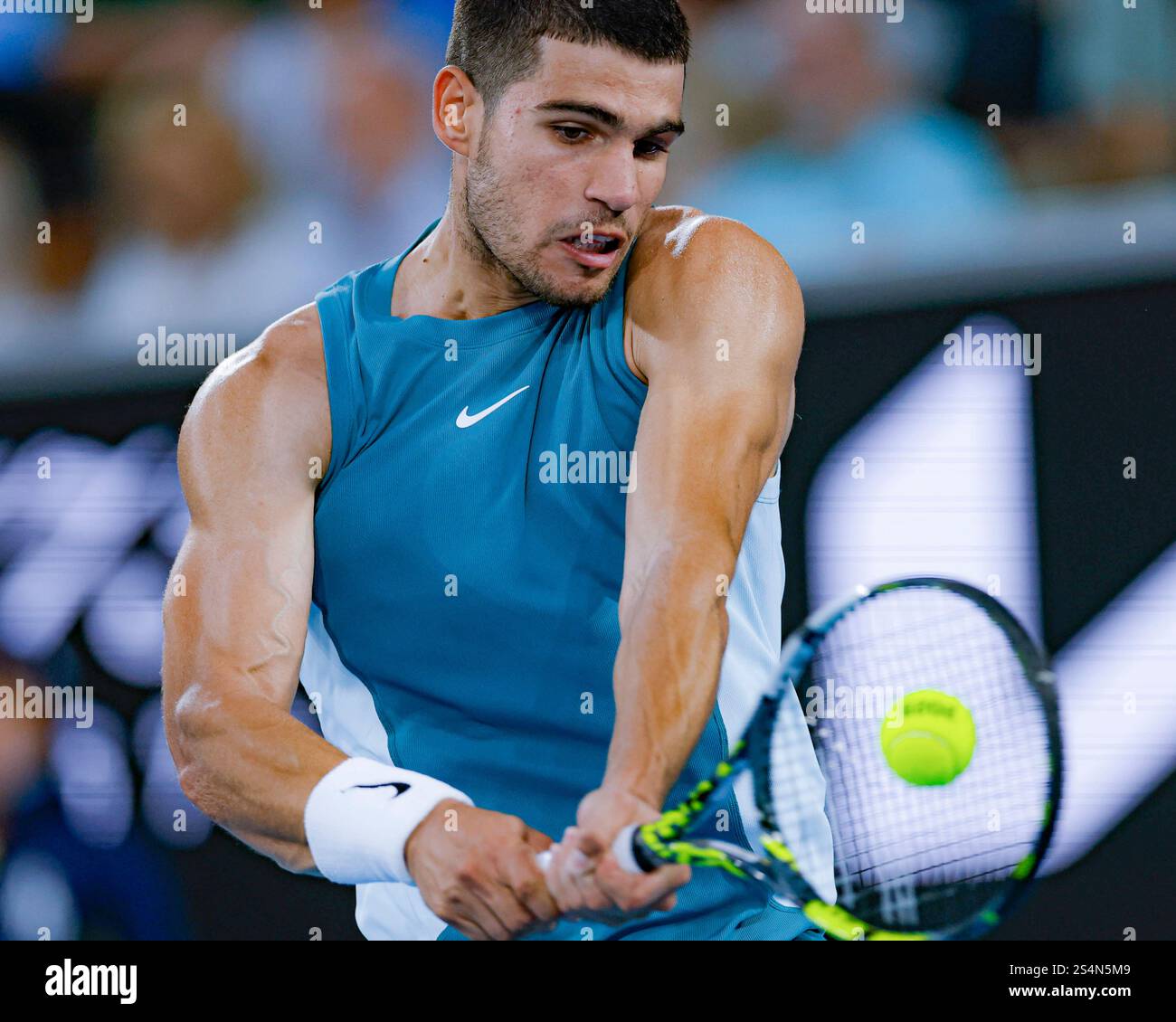 Melbourne, Australia. 13th Jan, 2025. Carlos Alcaraz hits a return during the men's singles first round match between Carlos Alcaraz of Spain and Alexander Shevchenko of Kazakhstan at Australian Open tennis tournament in Melbourne, Australia, Jan. 13, 2025. Credit: Chu Chen/Xinhua/Alamy Live News Stock Photo