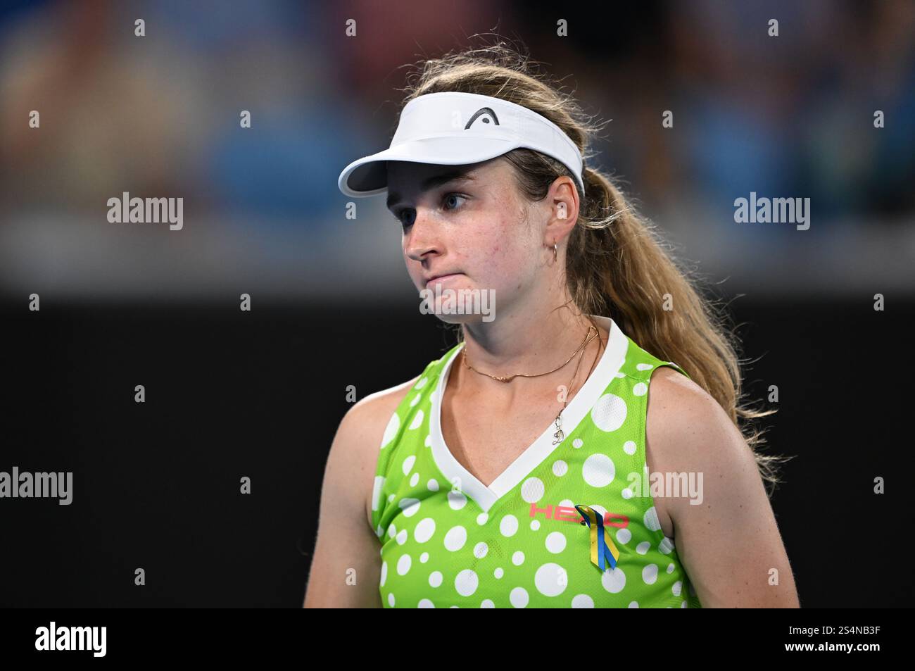 Daria Snigur of Ukraine looks on during her round 1match against