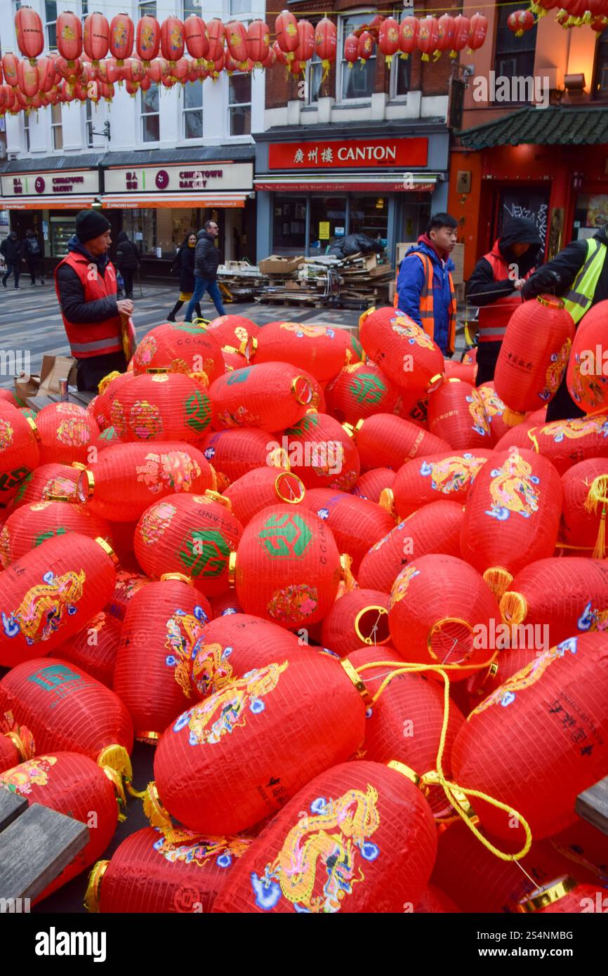 London, UK. 13th January 2025. Workers prepare new red lanterns in Chinatown ahead of Chinese New Year, also known as Lunar New Year. 2025 is the Year of the Snake. Credit: Vuk Valcic/Alamy Live News Stock Photo