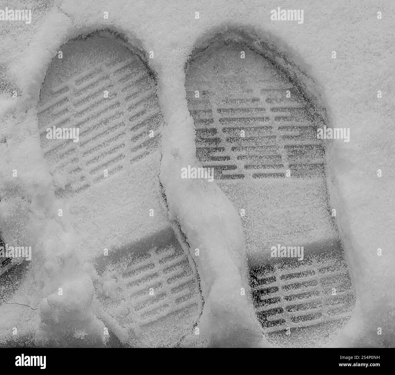 Footprints in the Snow: Winter Fun. Proof of existence. Stock Photo