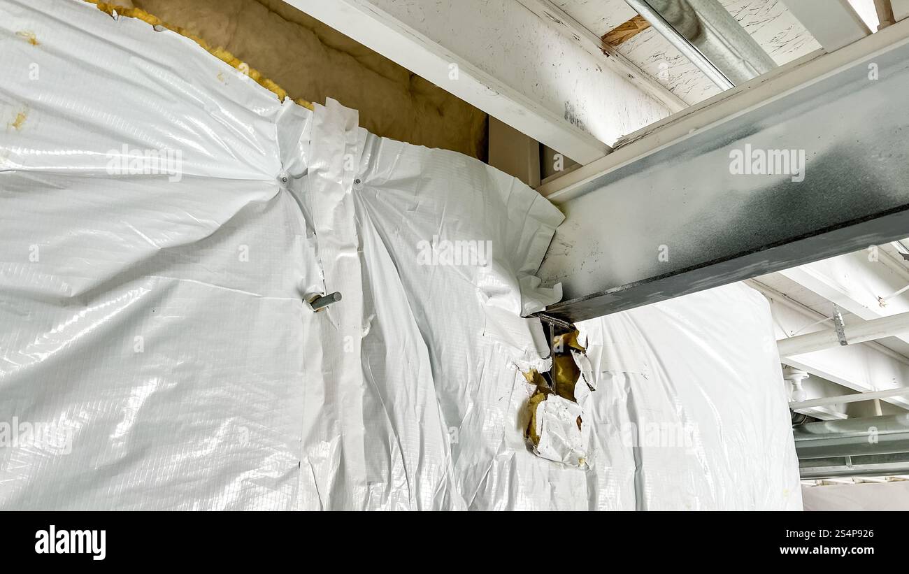 View of Exposed Metal Beam in Basement Construction Stock Photo - Alamy